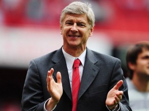 Arsene Wenger applauds his team