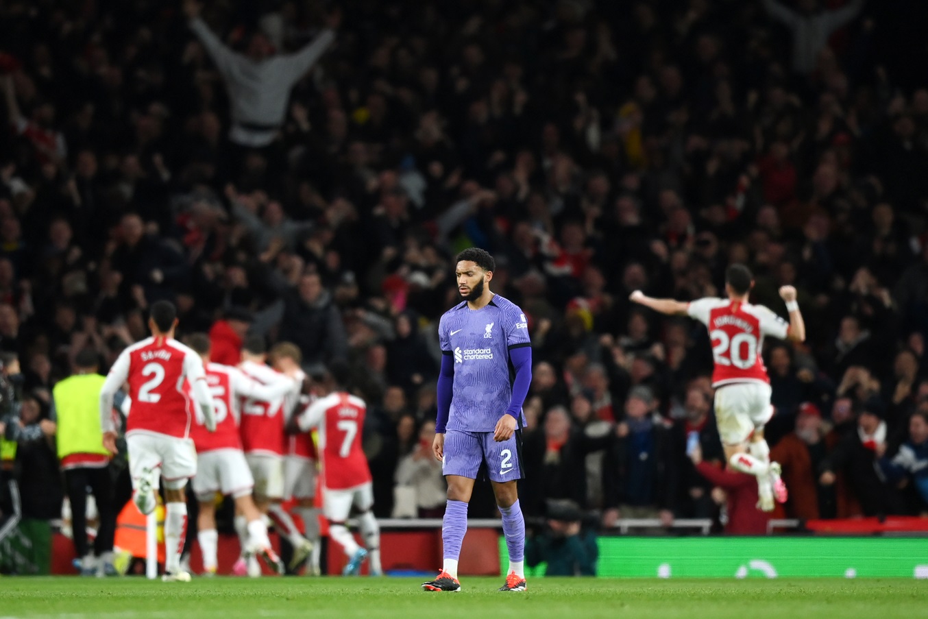 Joe Gomez of Liverpool looks dejected after Gabriel Martinelli of Arsenal scores his team's second goal