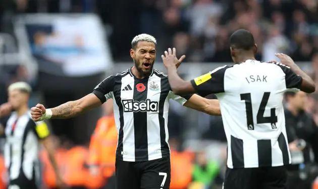 Joelinton and Alexander Isak of Newcastle United celebrate after the team's victory in the Premier League match between Newcastle United FC and Arsenal FC