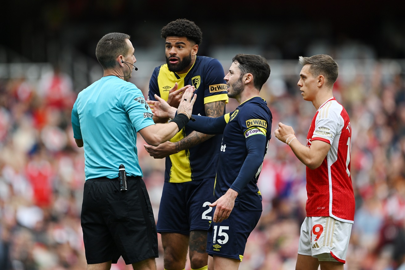 Philip Billing and Adam Smith of AFC Bournemouth react towards Referee David Coote after their team's first goal scored by Antoine Semenyo (not pictured) is disallowed 