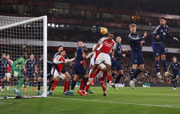 Jurrien Timber of Arsenal scores his team's first goal with a header as Andre Onana of Manchester United fails to make a save during