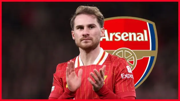 Alexis Mac Allister claps his hands in front of Arsenal club badge.