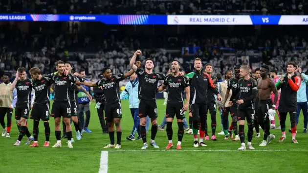 Arsenal players celebrating after beating Real Madrid